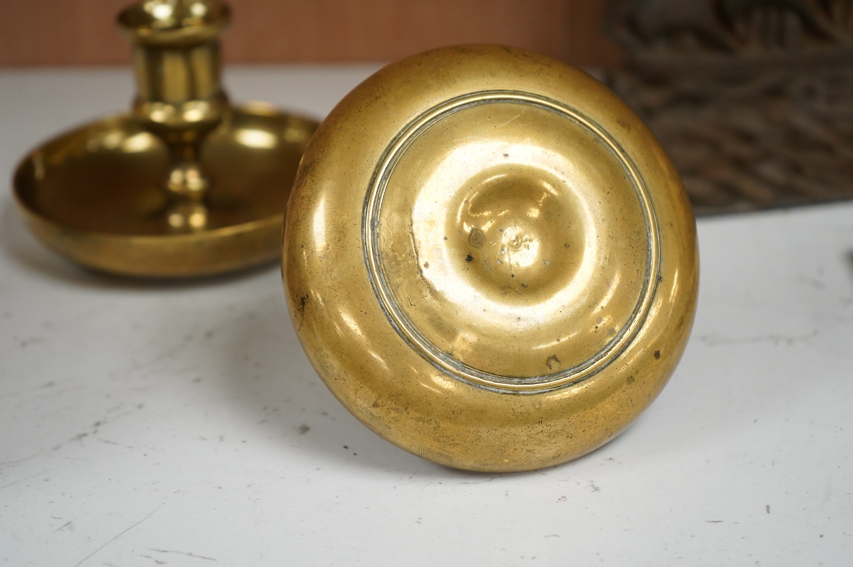 A pair of early 19th century brass ‘Brighton bun’ travelling candlesticks, 7cm high